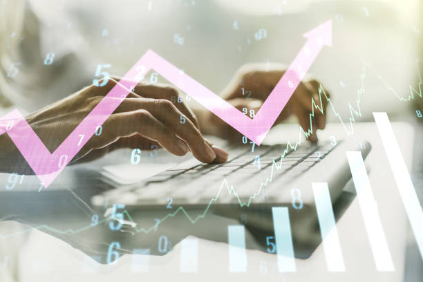 istock Multi exposure of abstract creative financial graph with upward arrow and hand typing on laptop on background, forex and investment concept 1301590728