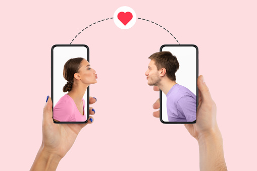 Virtual Date, Celebrating Valentine's Day Online. Creative collage of young couple blowing virtual air kissing from the screen of their smartphones, boyfriend and girlfriend holding gadgets