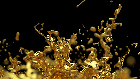 Abstract Gold splash with depth of field on back background.