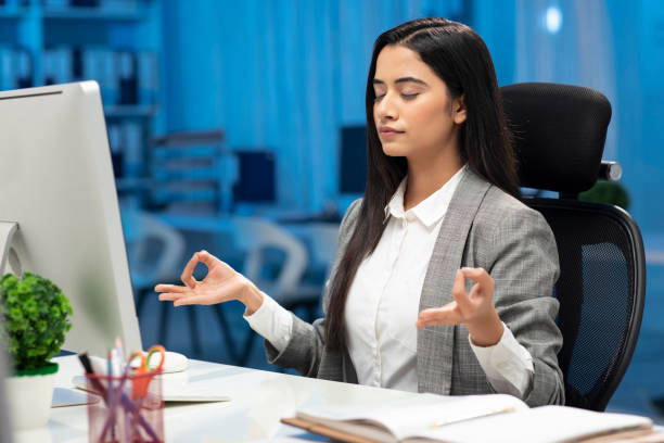 business woman at office, stock photo - yoga business women indoors imagens e fotografias de stock