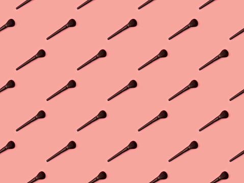 Seamless repetitive Makeup Brush on Pink background