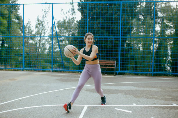 istock Female Basketball Player In Action 1301596957