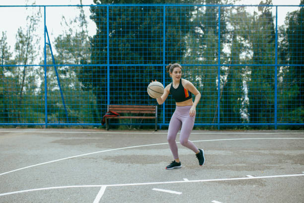 istock Female Basketball Player In Action 1301596999
