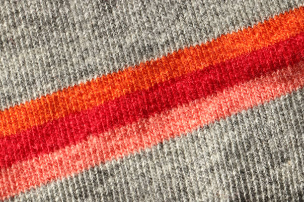 istock Colored gray orange red peach textile texture. Color fabric background. 1301598113