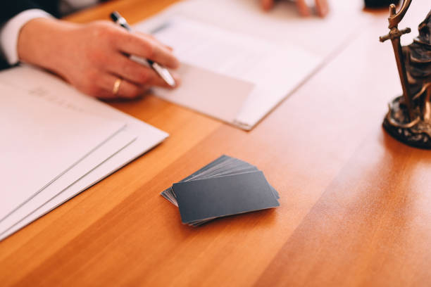 istock Business cards at lawyers office 1301598233