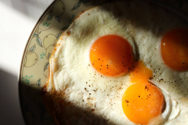 Fried scrambled eggs with pepper on a plate.