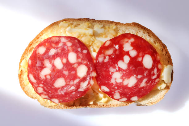 istock Isolated sandwich with cheese eggs sausage and butter 1301598293