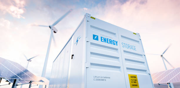 Conceptual image of a modern battery energy storage system with wind turbines and solar panel power plants in background. 3d rendering Conceptual image of a modern battery energy storage system with wind turbines and solar panel power plants in background. 3d rendering renewable energy stock pictures, royalty-free photos & images
