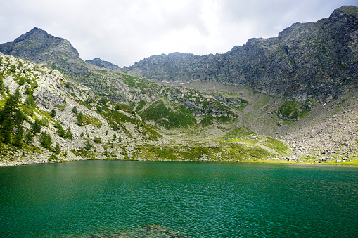 Turquoise water of the Mognola lake with beautiful mountain panorama, Ticino, Switzerland