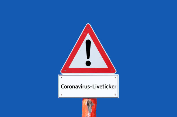 istock Caution warning sign coronavirus live ticker on blue background 1301601402