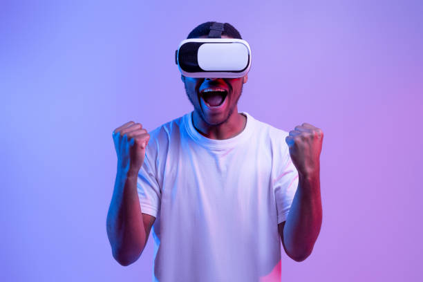 istock Euphoric Black Guy Playing Video Game In VR Glasses, Exclaiming With Excitement 1301602499