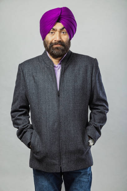 studio portrait of a sikh handsome man looking at camera with smile - 2546 imagens e fotografias de stock