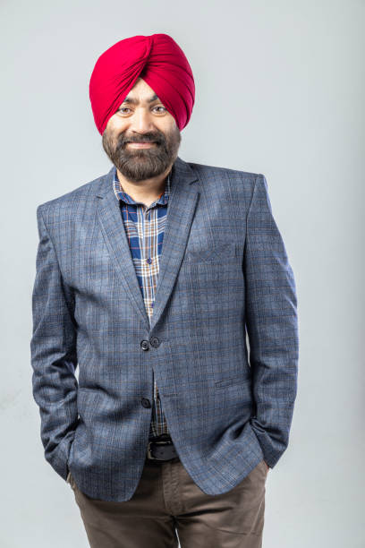 istock Studio portrait of a Sikh handsome man looking at camera with smile 1301604305