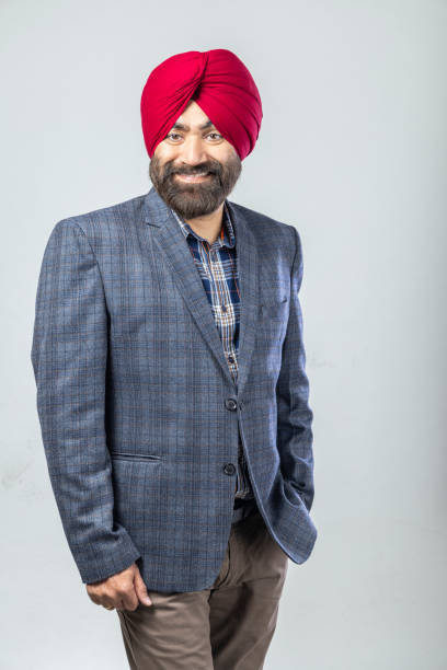 istock Studio portrait of a Sikh handsome man looking at camera with smile 1301604411