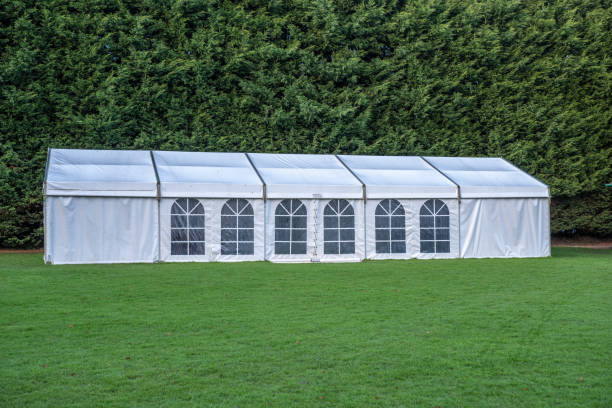 istock Large white marquee tent on lawn 1301604909