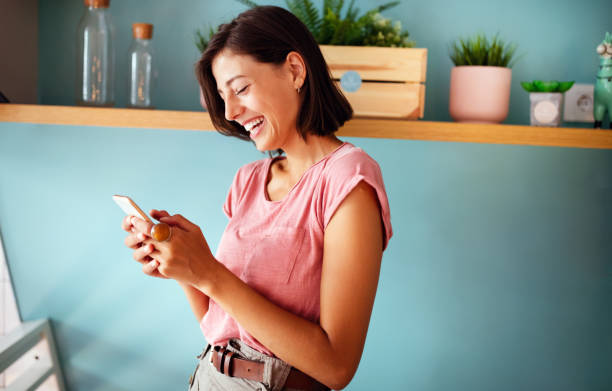istock Image of young woman using cellular phone 1301605958