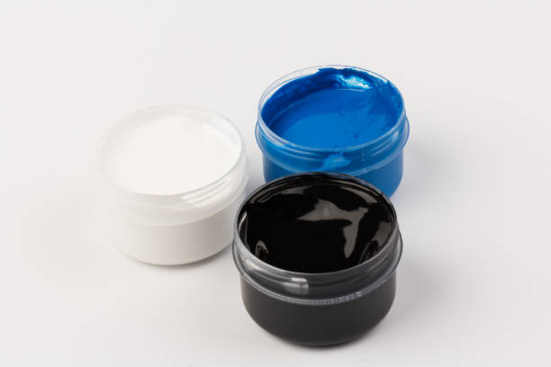 istock Plastic jars with paint of different colors for children's creativity on white background. Paint bottles for art 1301608402