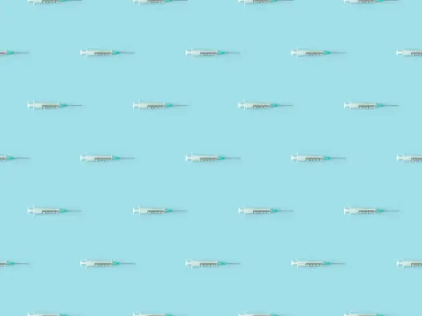 Photo of Seamless repetitive Syringe on blue background