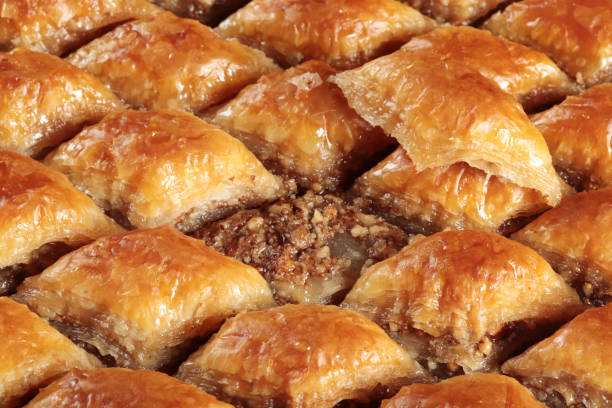 istock Traditional Turkish dessert Baklava. With walnuts and pistachios. 1301610813