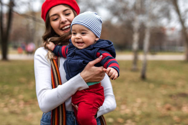 istock Happy little boy in mother`s hands 1301612444