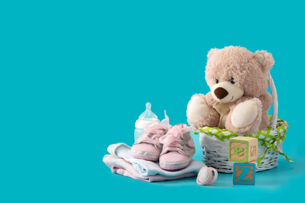 istock Teddy bear, pacifier, feeding bottle and shoes 1301613577
