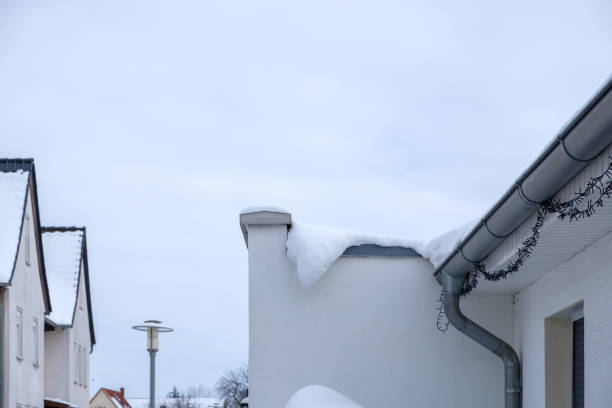 istock Snow on a house roof 1301614104