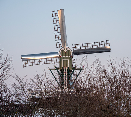 Close up of tower mill the 'de Koe' in Veere, Zeeland, the Netherlands. Vertical windmill consisting of a brick or stone tower.
