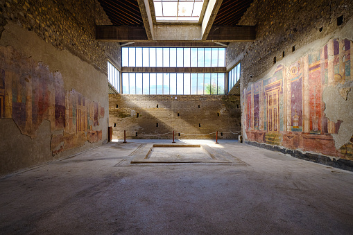 Torre Annunziata, Italy - August 28, 2020: Ancient Roman ruins of Poppea Villa in the city of Oplontis now called Torre Annunziata, famous place for well preserved Roman frescoes, no people in the scene, photo taken in Torre Annunziata in Naples province, Italy.
