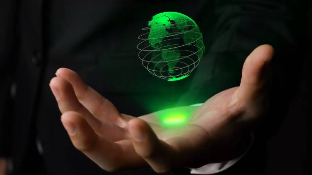 istock Human hand holding earth globe holographic technology 1301619448