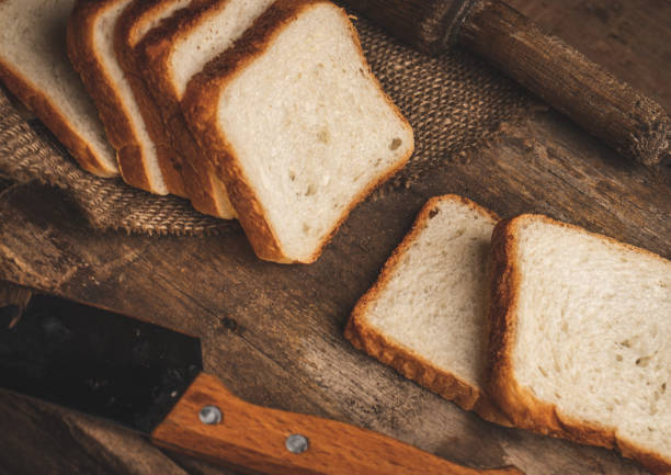 Sliced Bread stock image with wooden background.