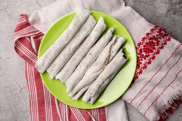 Til pitha a traditional food of Assam  isolated stock image.