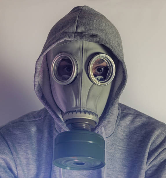 istock A man in a gas mask. Stalker. Sepia 1301621606