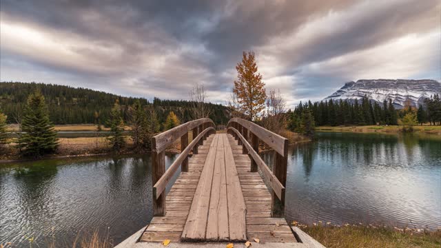 Mount Rundle with wooden bridge in autumn park at Cascade Ponds, Banff national park, Canada