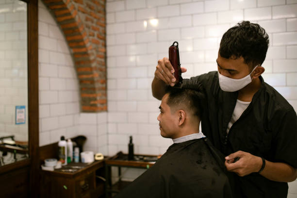 istock young asian man at hair salon 1301625472