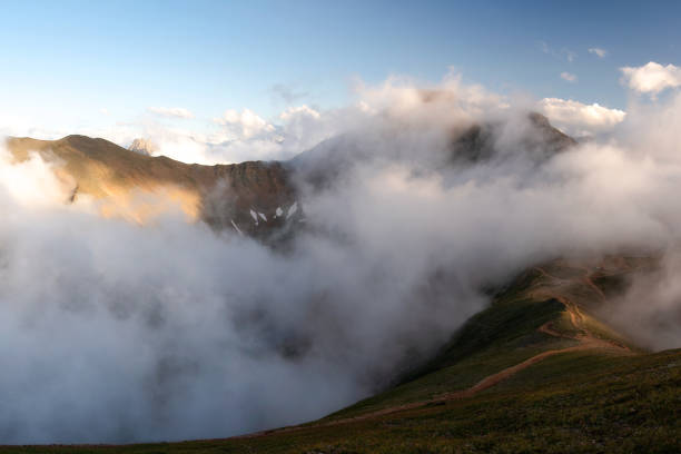 istock mountain gorge Mukhinskoe under a layer of low clouds. 1301625645