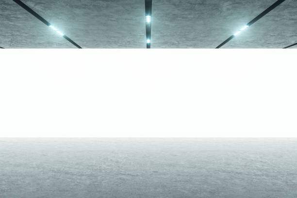 istock Front view on big blank white screen wall for presentation in modern concrete style room. Mockup. 3D rendering 1301625841