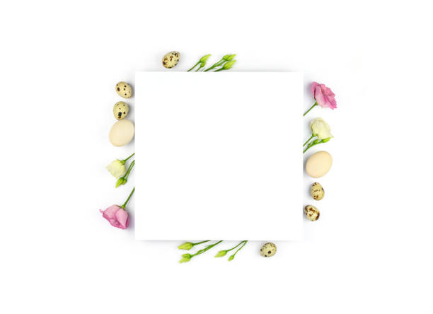 istock Easter composition. Easter eggs, flowers, paper blank on white background. Flat lay, top view, copy space, mock up. 1301627222