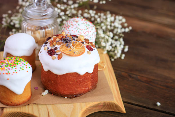 istock Easter cake and Easter eggs festive celebration table setting traditional decoration and treats. Happy easter holiday on the table meal snack outdoor top view copy space  food background rustic 1301631038