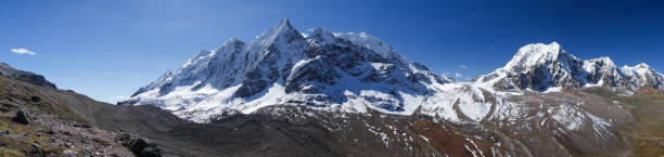 istock beautiful mountains with snow tops and blue sky 1301632376