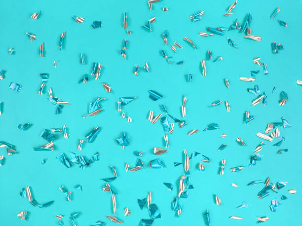 istock Confetti foil pieces on blue background. Abstract festive backdrop. 1301632505