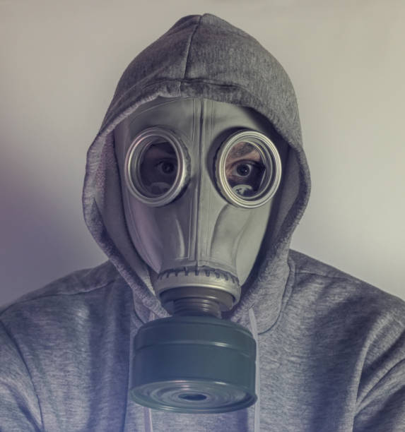 istock A man in a gas mask. Stalker. Sepia 1301634099