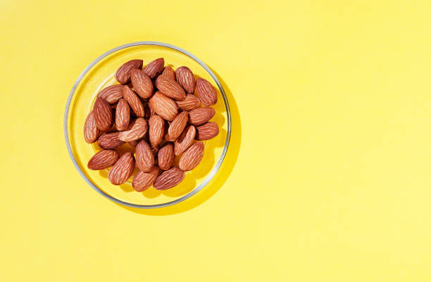 istock Heap of almonds on plate 1301636782