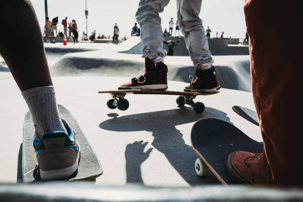 istock Closeup of skateboard by skate pool 1301639109