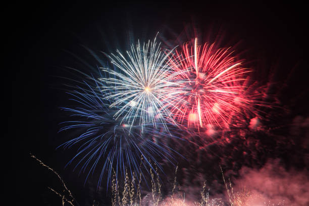 istock Fireworks light up the sky with smoke. Colorful. 1301641472