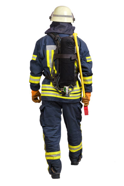 istock Back side view of walking firefighter in fire-proof uniform 1301642960