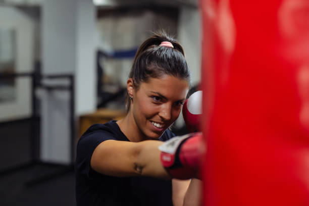 istock Girl practicing punching on a punching bag 1301643705