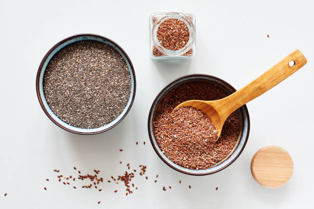 Flax and chia seeds. Flax seeds and chia seeds in bowls, top view. chia seed photos stock pictures, royalty-free photos & images