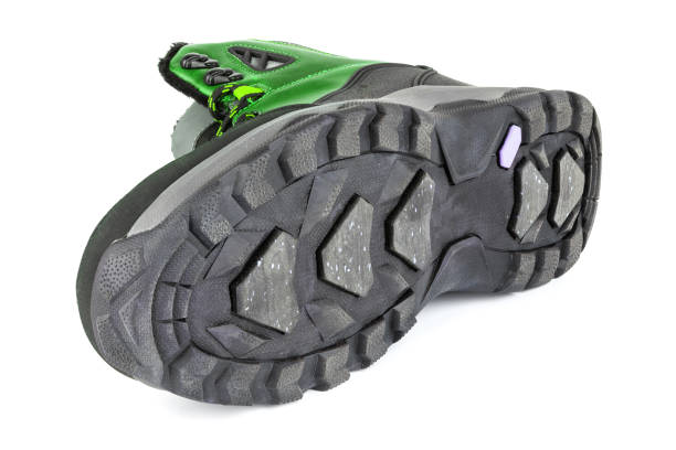 istock insulated green winter warm three quarter sneaker or boot isolated on white background, laid on side 1301645110