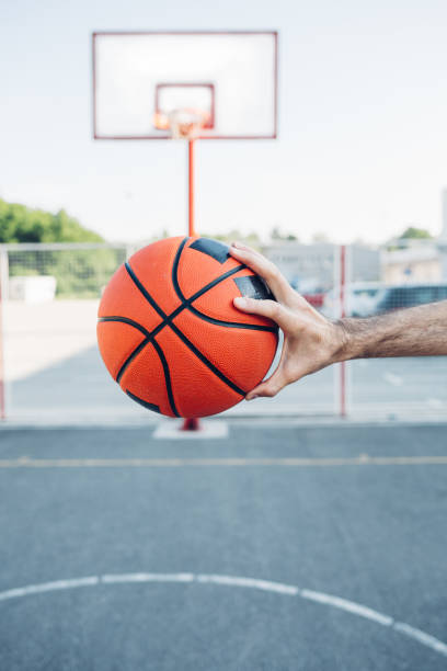 istock Basketball Player Holding A Ball 1301648027
