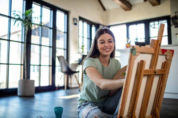 istock Creative Woman Panting At Home 1301648259